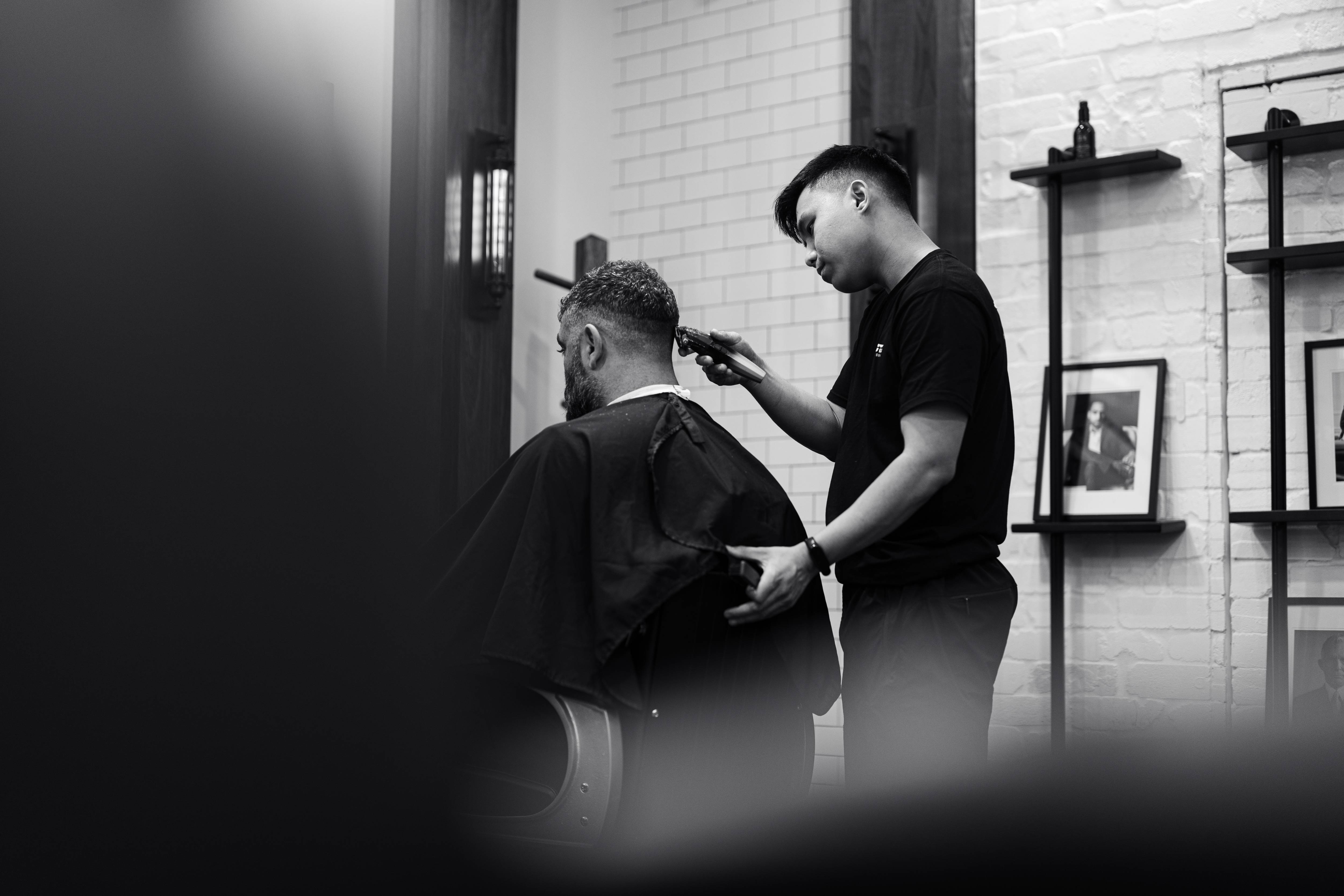Barber giving a precision haircut